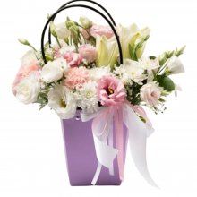 Arrangement of flowers in a handbag